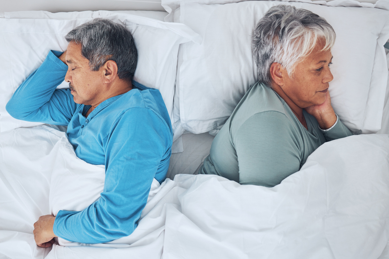 Sleeping, above and a senior couple in a bed with fatigue in a marriage together. Top view, relax and a tired elderly man and woman in the bedroom for rest, peace and napping with comfort in a house