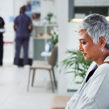 Thinking, sad and senior woman in clinic, grief and depression with emotions. Thoughts, mature person and old lady with results, medical and fear of cancer with loss, healthcare and hospital