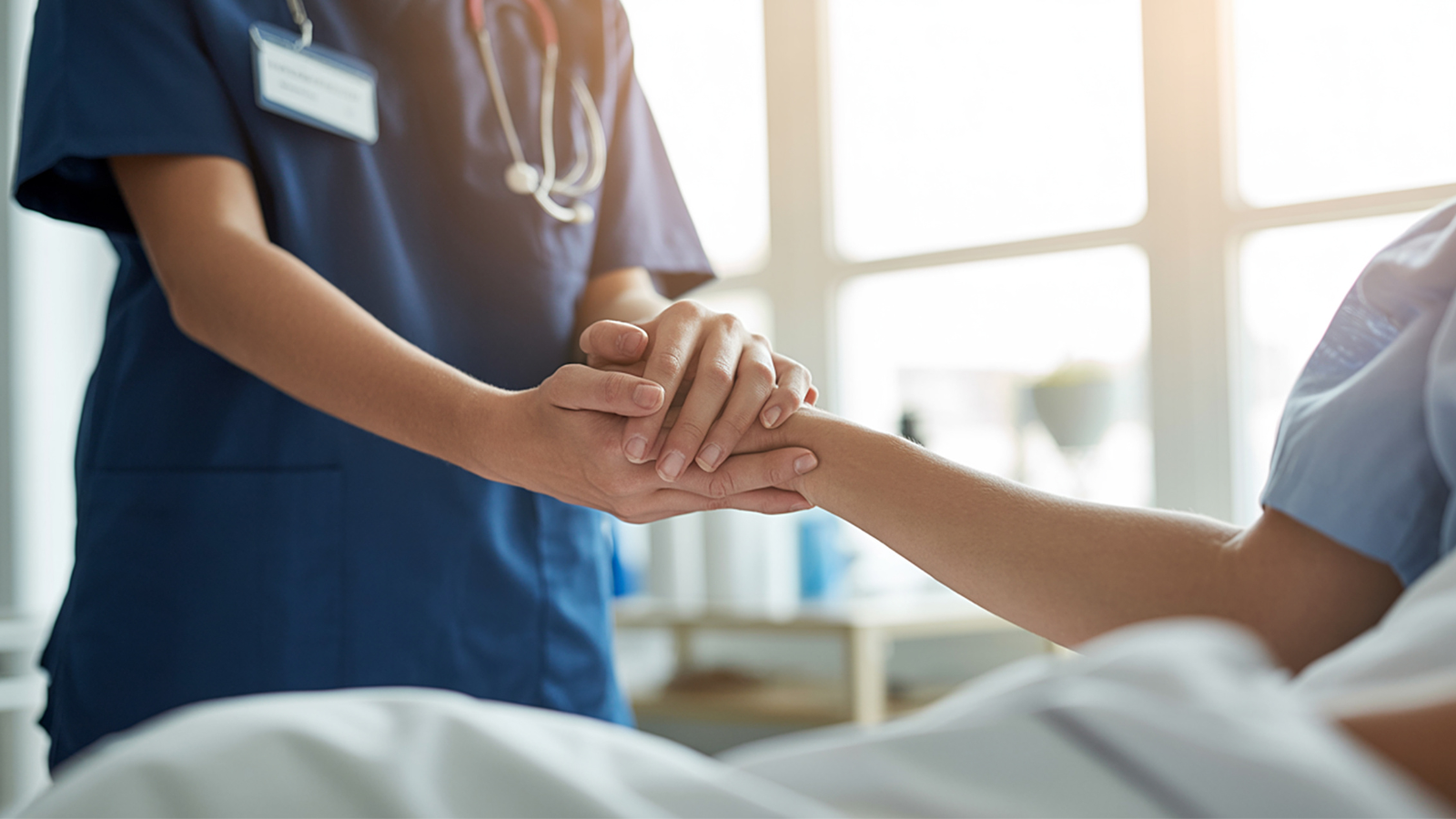 nurse holding cancer patient's hand
