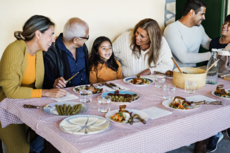 Latino family having dinner.