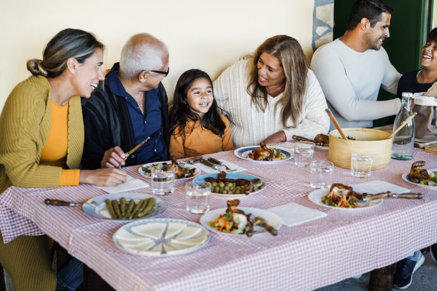 Latino family having dinner.
