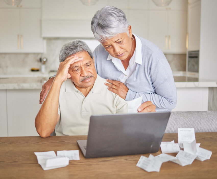 Stress, senior couple and laptop with finance paper and taxes for financial security investment. Sad, depression or mental health anxiety while planning retirement budget or insurance funeral savings