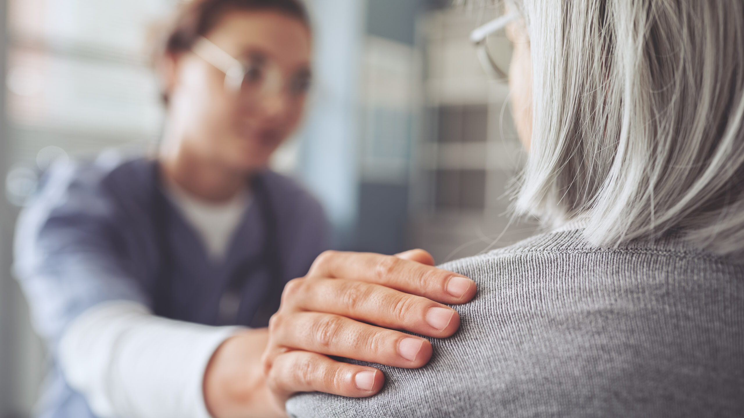 Healthy lifestyle and medical concept, the healthcare worker talks to the elderly patient and comforts her