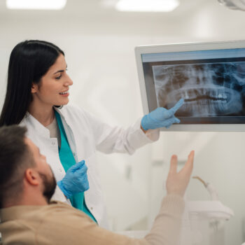 Latino man visiting dentist.
